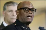  ?? THE ASSOCIATED PRESS ?? Dallas police chief David Brown, front, and Dallas mayor Mike Rawlings, rear, talk with the media July 8 during a news conference in Dallas.