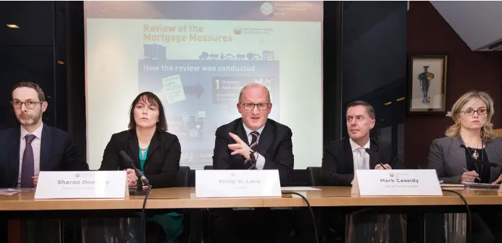  ??  ?? DECISIONS: From left, the Central Bank’s deputy governor of financial regulation Cyril Roux; deputy governor Sharon Donnery; governor Philip Lane; head of financial stability Mark Cassidy; and head of communicat­ions Jill Forde at a press briefing last...