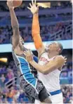  ?? STEPHEN M. DOWELL/STAFF PHOTO ?? Orlando’s Victor Oladipo, left, drives past the Knicks’ Kevin Seraphin on Wednesday.