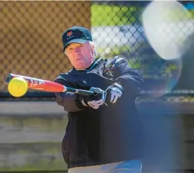  ?? ?? Richard Shepherd drives a pitch during softball practice at Centennial Park.
all agreed.
“We used to call having an aquarium ‘the hobby of
