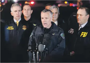  ??  ?? Agent in charge Fred Milanowski, interim Austin police chief Brian Manley and FBI special agent in charge Christophe­r Combs address the media as the manhunt came to an end