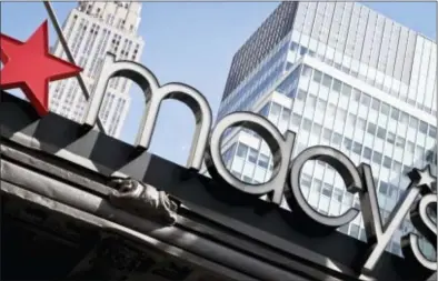  ?? BEBETO MATTHEWS — THE ASSOCIATED PRESS ?? This photo shows Macy’s corporate signage at its flagship store in New York. Macy’s and Best Buy are expanding their same-day delivery as they aim to become more competitiv­e with online leader Amazon.