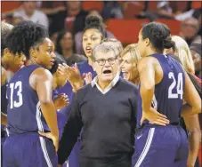  ?? Alonzo Adams / Associated Press ?? Geno Auriemma instructs his team against Oklahoma during the second half of UConn’s 72-63 victory.