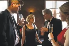  ?? Paul Kuroda / Special to The Chronicle ?? Carey Perloff chats with playwright Tom Stoppard, flanked by her children Nick Perloff-Giles and Lexie Perloff-Giles.