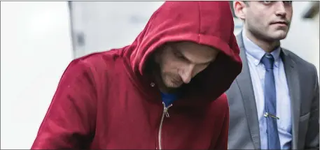  ??  ?? Murder accused Rafal Karacyzn leaving Sligo District Court after being charged with his wife’s murder. Pic: Donal Hackett