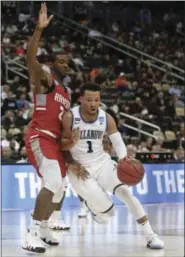  ?? THE ASSOCIATED PRESS FILE ?? Villanova’s Jalen Brunson drives on Radford’s Ed Polite Jr. during an NCAA men’s tournament first-round game in Pittsburgh. Villanova takes on West Virginia in a regional semifinal on Friday.