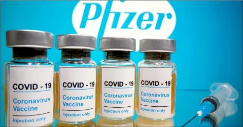  ??  ?? Vials of the Pfizer COVID-19