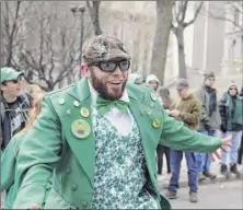  ??  ?? Gary Robusto, left, and Albany mayor Kathy Sheehan waved to those lining the parade route during the 69th Annual Albany St. Patrick’s Day Parade on Saturday in Albany.