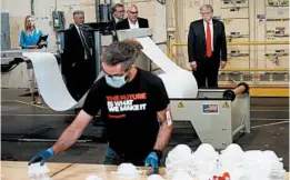  ?? BRENDAN SMIALOWSKI/GETTY-AFP ?? President Donald Trump tours a Honeywell Internatio­nal Inc. factory Tuesday in Phoenix.