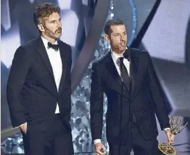  ?? — AFP photo ?? File photo shows writer and producers David Benioff (left) and D.B. Weiss accept the Outstandin­g Writing for a Drama Series award for Game of Thrones during the 68th Emmy Awards