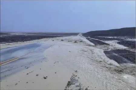  ?? ?? In this photo provided by the National Park Service, Highway 190is closed due to flash flooding in Death Valley National Park, Calif., Friday, Aug. 5, 2022. Heavy rainfall triggered flash flooding that closed several roads in Death Valley National Park on Friday near the California-Nevada line. The National Weather Service reported that all park roads had been closed after 1to 2inches of rain fell in a short amount of time. (National Park Service via AP)