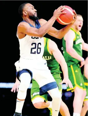 ?? AP ?? United States’ Kemba Walker attempts a shot during their exhibition basketball game against Australia in Melbourne yesterday.