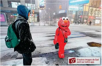  ?? –AFP ?? Sur Times Square, il faisait un temps à ne pas mettre une marionnett­e dehors.