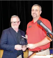  ??  ?? Larry Oelrich (left), receives the Lifetime Achievemen­t Award from chamber president Dale Reed. Oelrich also received a citation from the Arkansas House of Representa­tives for 40 years with the city of Prairie Grove..