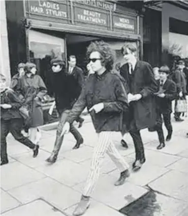  ??  ?? 0 Bob Dylan taking a stroll along Edinburgh’s Princes Street in 1966. Far left: the legend on stage the same year. Left: the Odeon, Glasgow