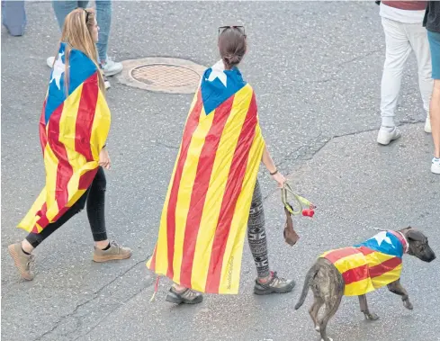  ??  ?? Pro-indepence supporters join an anti-police demonstrat­ion in Lerida, Catalonia, on Monday.