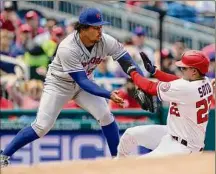  ?? Alex Brandon / Associated Press ?? Mets pitcher Taijuan Walker, left, makes the tag on the Nationals' Juan Soto on a fielder's choice on Thursday.