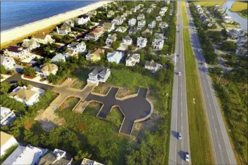  ?? GARY EMEIGH - THE ASSOCIATED PRESS ?? A July 16 aerial photo of Bethany Beach, Del. shows a wooden road built on pilings in one of the freshwater wetlands in coastal Delaware where the Bethany Beach Firefly, which some environmen­talists want added to the federal Endangered Species List, has been previously found.