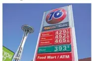  ?? AP PHOTO/TED S. WARREN ?? Gas prices are shown at a station Sept. 2 near the Space Needle in Seattle.