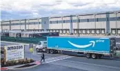  ?? EDUARDO MUNOZ AVAREZ AP ?? Amazon is barring off-duty warehouse workers from facilities, such as this one in Staten Island, N.Y.