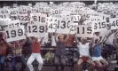  ?? Allan Tannenbaum/Getty Images ?? People hold up signs representi­ng the numbers of Aids victims in a demonstrat­ion in Central Park, in August 1983. Photograph: