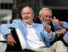  ?? Associated Press ?? Legends on the links: In this Oct. 22, 2010, file photo, Former President George H. W. Bush, left, and golfing great Arnold Palmer acknowledg­e the gallery at the Champions Tour golf tournament in The Woodlands, Texas. Bush, who died Friday, was one of two presidents inducted into the World Golf Hall of Fame.