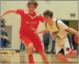  ??  ?? Chittenang­o’s Dylan Voutsinas (2) drives towards the basket as Vernon‑Verona‑Sherrill’s Rylin Turley (30) defends.