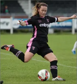  ??  ?? Kylie Murphy delivers a pass as Galway’s Sadhbh Doyle looks on.