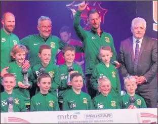  ??  ?? Kevin Keegan stands with the Greentower­s Swords Under-9s football team after they finished runners up in the ESF Festival of Football tournament.