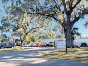  ?? RYAN GILLESPIE/ORLANDO SENTINEL ?? The shaded parking lot of the Florida Department of Health off Central Boulevard is where the Parramore Farmers Market will relocate.