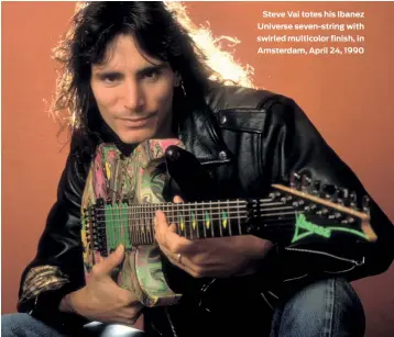  ??  ?? Steve Vai totes his Ibanez Universe seven-string with swirled multicolor finish, in Amsterdam, April 24, 1990