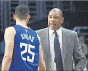  ?? Michael Owen Baker Associated Press ?? DOC RIVERS may sit son Austin, one of the many Clippers nursing injuries, in the final two games.