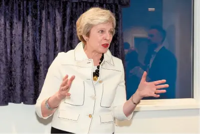  ?? ?? Theresa May questioned Boris Johnson over the Sue Gray report on Monday. Ref:132434-31
