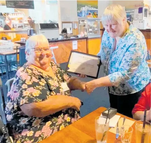  ?? ?? Taranaki Disabiliti­es Informatio­n Centre Trust representa­tive Kirsty Linnell (right) presents Shirley Hazlewood with her Disabled Person Assembly life membership at a ceremony held at Colonel Malone’s Restaurant and Bar in Stratford.