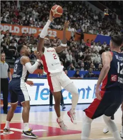  ?? DITA ALANGKARA — THE ASSOCIATED PRESS ?? Canada guard Shai Gilgeous-Alexander (2) shoots against France’ Elie Okobo (0) and Nando De Colo (12) during the Basketball World Cup group H match at the Indonesia Arena stadium in Jakarta, Indonesia on Friday.