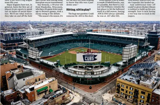  ?? ZBIGNIEW BZDAK / CHICAGO TRIBUNE ?? BELOW: Wrigley Field, home of the Cubs, is one of the ballparks fans outside the stadium can watch a game. People often gather on rooftops to take in the action.