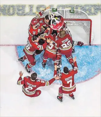  ?? DAVE HOLLAND HOCKEY CANADA IMAGES ?? Thorold native Ryan Miotto (7) joins his teammates in celebratin­g the Chilliwack Chiefs victory over the Wellington Dukes for the RBC Cup Canadian junior A hockey championsh­ip Sunday in Chilliwack, B.C.