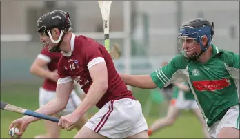  ??  ?? A determined looking Seán Stafford of St. Martin’s races away from Dunbrody full-back Tommy Walsh.