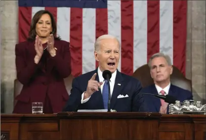  ?? JACQUELYN MARTIN-POOL — GETTY IMAGES ?? U.S. President Joe Biden delivers the State of the Union address to a joint session of Congress as Vice President Kamala Harris and House Speaker Kevin McCarthy listen on Tuesday in the House Chamber of the U.S. Capitol in Washington.