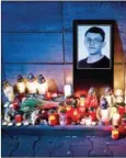  ?? VLADIMIR SIMICEK/AFP ?? Candles and a portrait of Slovak reporter Jan Kuciak in front of the Aktuality newsroom in Bratislava on February 26.