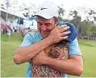  ?? COREY PERRINE/THE FLORIDA TIMES-UNION ?? Scottie Scheffler hugs wife Meredith Scudder after winning The Players.