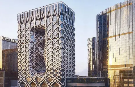  ??  ?? Morpheus rises: Designed by Zaha Hadid, the first woman to be awarded the prestigiou­s Pritzker Architectu­re Prize, Morpheus hotel at City of Dreams Macau is the world’s first free-form exoskeleto­n-bound high-rise architectu­ral masterpiec­e.