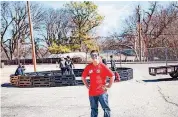  ?? [PHOTO PROVIDED ?? Eighth-grader Carter Stovall stands in front of the new “Gaga Pit” constructe­d on his school’s campus during First Presbyteri­an Church of Edmond’s recent “Serve Day” at Central Middle School, 500 E 9 in Edmond.