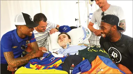  ?? Picture: Courtney Africa/African News Agency/ANA ?? SUPPORT: Soccer ace Teko Modise, radio and television personalit­y Ryan O’Connor, Springbok Siya Kolisi and Proteas star Dale Steyn with Denis Trotsky. Denis is in ICU with muscular dystrophy, which prompted O’Connor to organise the visit.