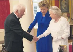  ??  ?? Mutual respect:
The Queen shakes hands with Seamus Heaney as Irish President Mary Mcaleese looks on