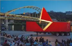  ??  ?? Dancer and choreograp­her Satchie Noro of Paris performs Compagnie Furinkaï’s “Origami” atop a redesigned shipping container Friday at Point State Park, Downtown. The piece, inspired by paper folding, was part of the Dollar Bank Three Rivers Arts Festival.