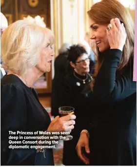  ?? ?? The Princess of Wales was seen deep in conversati­on with the Queen Consort during the diplomatic engagement.