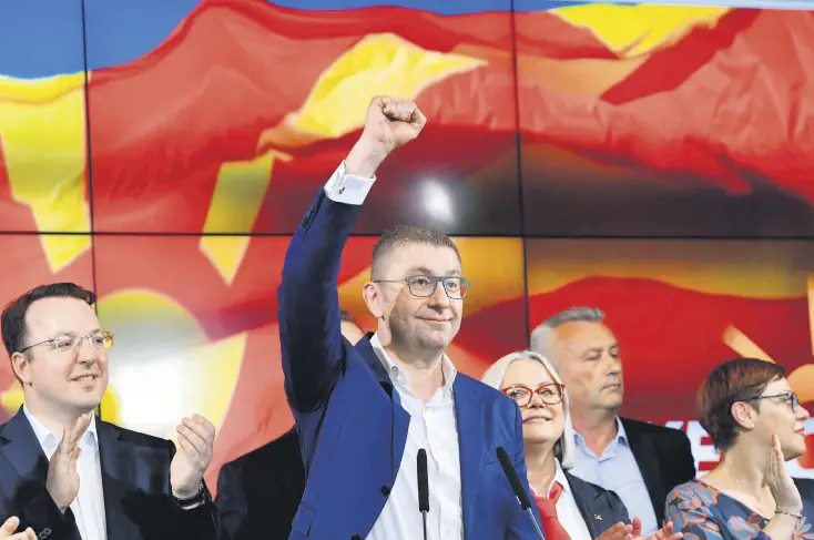  ?? ?? North Macedonia’s VMRO-DPMNE party leader Hristijan Mickoski (C) waves during a news conference amid parliament­ary and presidenti­al elections in Skopje, North Macedonia, May 8, 2024.