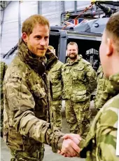  ??  ?? At ease: Harry meets the troops