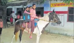  ?? SHARIQ RAIS SIDDIQUI/HT ?? Junior High School, Gotutti, in Uttar Pradesh’s Bahraich, offers its students a horse ride as a reward for attending classes. Headmaster Mohd Jafar Khan says the initiative has brought those who had dropped out, or are irregular, back to the classrooms and is a success not least because the idea is the brainchild of the school’s two Class 7 boys, brothers Mohd Ahmad and Mohd Zaid, whom Khan now plans to get rewarded by the basic education department.